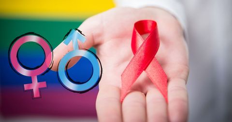 Red ribbon and gender symbols highlighting lgbt rights