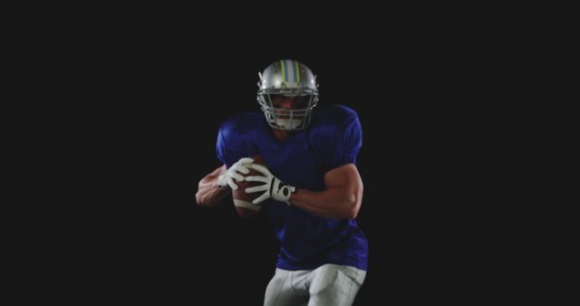 Football player in action on black background - Download Free Stock Images Pikwizard.com