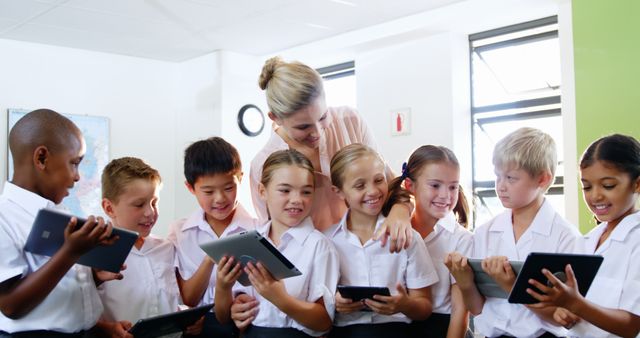 Smiling Students and Teacher Using Tablets in Classroom - Download Free Stock Images Pikwizard.com