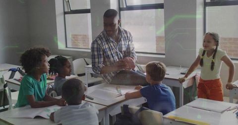 Teacher Showing Human Brain Model to Curious Elementary Students During Science Lesson