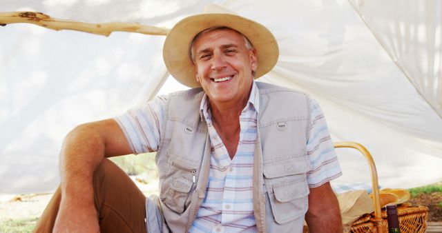 Elderly Man Enjoying Sunny Day in Nature During Picnic - Download Free Stock Images Pikwizard.com