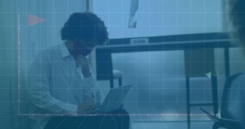 Man with Laptop and Mask in Modern Workspace with Grid Overlay