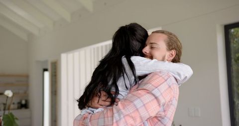 Warm Embrace Between a Loving Couple at Home - Download Free Stock Images Pikwizard.com