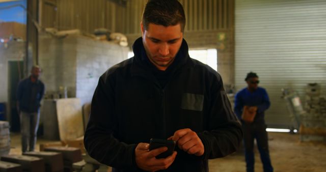 Factory Worker Using Smartphone in Industrial Setting - Download Free Stock Images Pikwizard.com