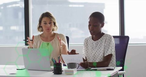 Collaborative professionals analyzing documents in modern office setting