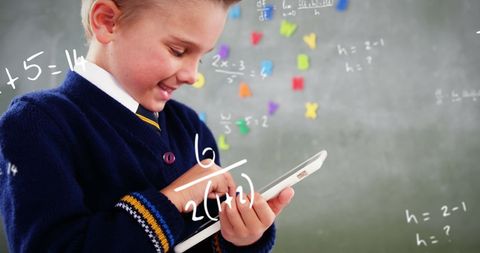 Schoolboy in Uniform Engaging with Digital Math Learning - Download Free Stock Images Pikwizard.com