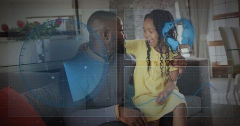 Father and daughter bonding at home exploring futuristic holographic globe and HUD