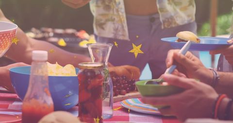 Friends Gathering for BBQ with Colorful Dinner Spread