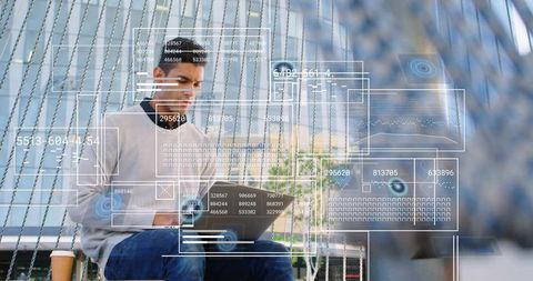 Young professional typing on laptop with augmented reality hud overlays in urban plaza
