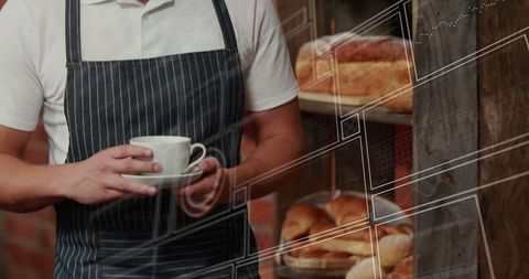 Barista Holding Coffee in Cozy Artisan Bakery with Fresh Bread Display