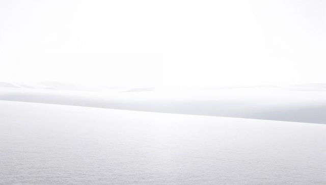 High-key minimal sand dunes featuring diagonal ridge, soft texture, monochrome calm