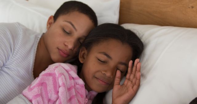 Mother and Daughter Sleeping Peacefully in Bed - Download Free Stock Images Pikwizard.com