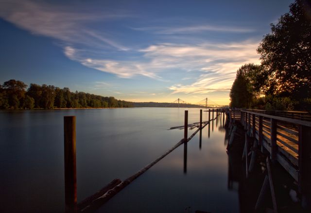 Beautiful view of Wooden pier over a lake at sunset. Nature and ecology concept