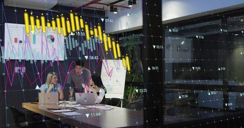 Business Team Analyzing Trends in Modern Meeting Room