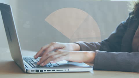 Hands Typing on Laptop Overlaid with Digital Graph Animation