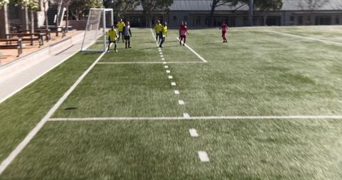 Youth Soccer Players Practicing on Sunny Day