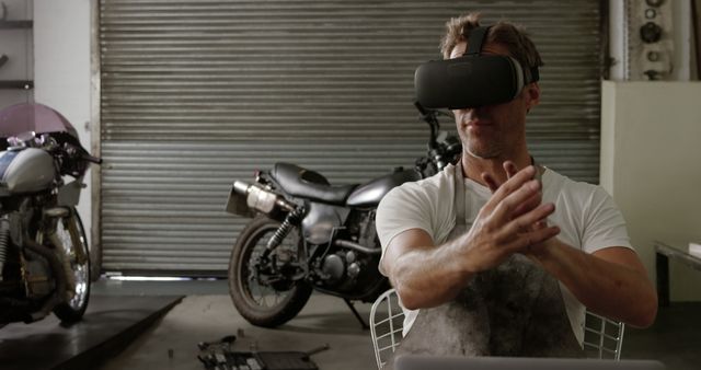 Mechanic Using VR Technology in Motorcycle Garage - Download Free Stock Images Pikwizard.com