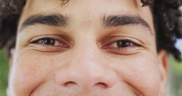 Close-up of Smiling Young Man's Eyes and Face - Download Free Stock Images Pikwizard.com