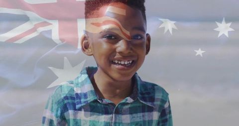 Happy Child with Australian Flag Symbol Close to Shoreline