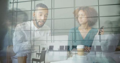 Business Professionals Collaborating at Modern Office Table