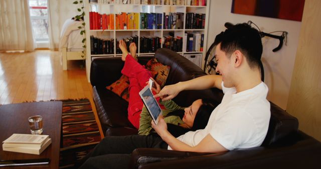 Father and Child Relaxing on Couch with Digital Tablet at Home - Download Free Stock Images Pikwizard.com