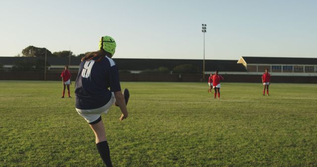 Female Rugby Player Kicking Ball During Practice on Field - Download Free Stock Images Pikwizard.com