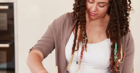 Young Woman Enjoying Cooking in Modern Kitchen - Download Free Stock Images Pikwizard.com