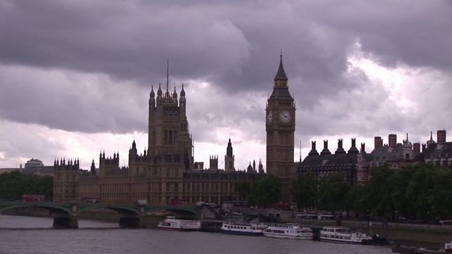 Depicts iconic landmarks Big Ben and the Palace of Westminster with a cloudy sky in London. Suitable for use in articles about London, travel guides, tourism brochures, history presentations, or cultural blogs. Highlighting historic architecture and famous UK landmarks.