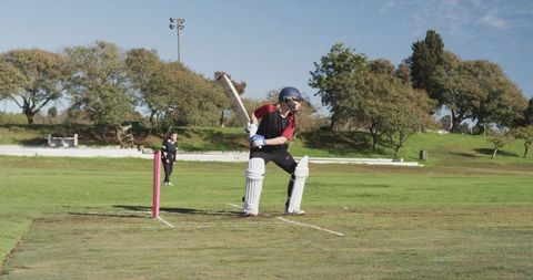 Female Cricketer Batting on Field During Match