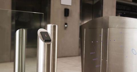 Modern Turnstile with Touchscreen Access Control in Corporate Lobby