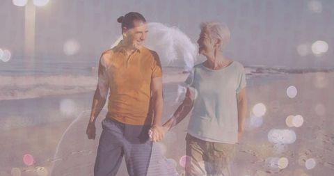 Couple Enjoying Peaceful Beach Walk at Sunset