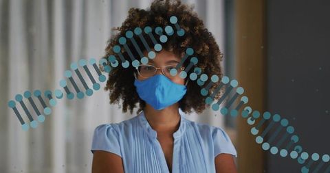 Standing professional wearing blue mask and glasses with dna double helix overlay in office