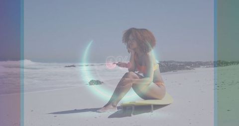 Woman in Orange Bikini Relaxing on Surfboard on Beach