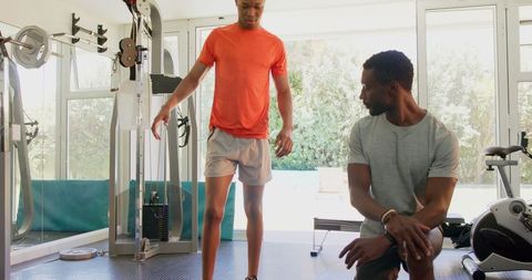 Men Engaged in Fitness Workout in Home Gym