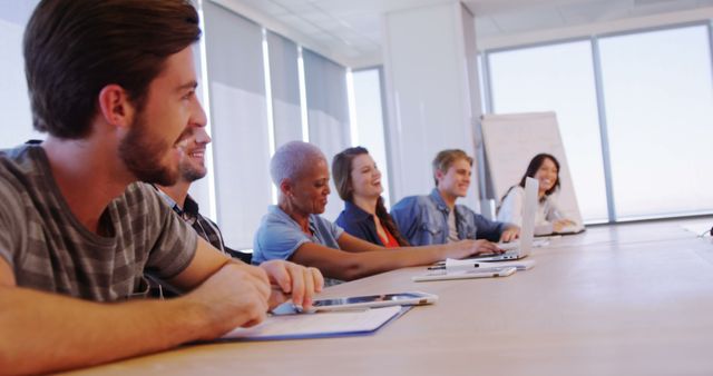 Diverse Team Engaging in a Meeting at Modern Office Table - Download Free Stock Images Pikwizard.com