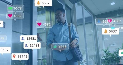 Businessman walking through glass office lobby with augmented reality social notifications