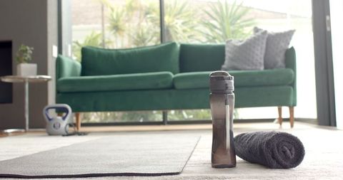 Home fitness setting with workout gear in modern living room