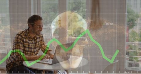 Businessman Working on Laptop with Overlaid Financial Data and Skull