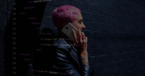 Talking woman with pink hair holding smartphone against brick wall with code overlay