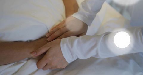 Daughter Comforting Father by Touching Arm in Gentle Setting