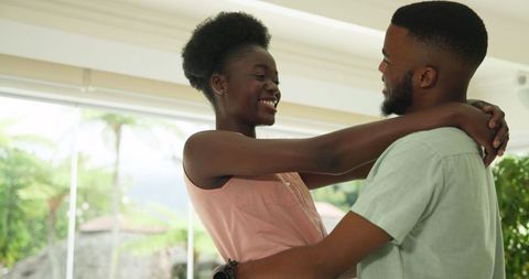 Joyful African American Couple Dancing Together at Home