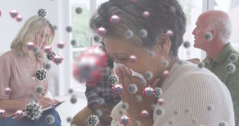 Senior woman sneezing with floating covid-19 visuals