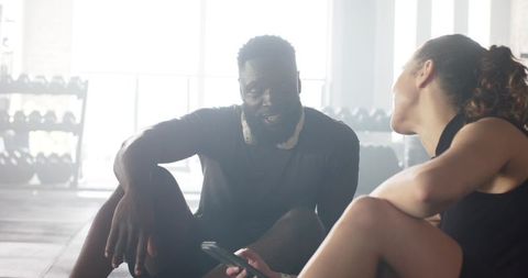 Diverse Friends Sharing Break at Gym for Fitness and Motivation