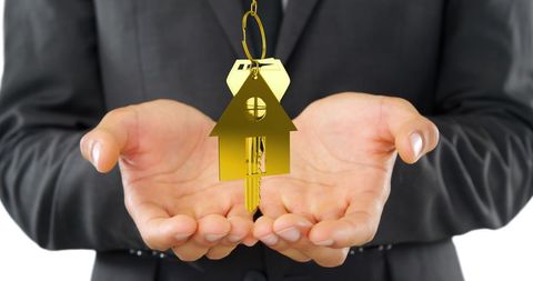 Golden House Keychains Hovering Above Cupped Hands - Download Free Stock Images Pikwizard.com