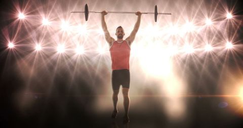 Young Athlete Lifting Barbell with Dramatic Lighting - Download Free Stock Images Pikwizard.com