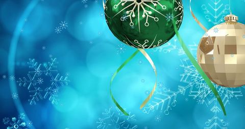 Festive Christmas Baubles on Snowy Blue Background