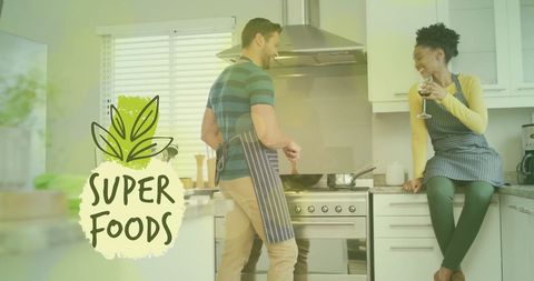 Diverse couple cooking healthy meal in modern kitchen