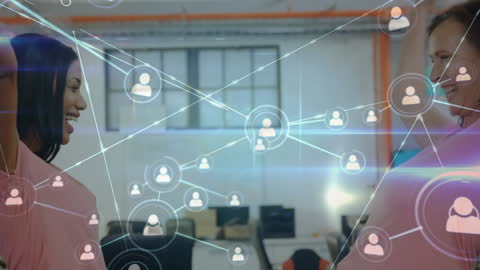 Diverse Women Hugging with Digital Network Overlay in Office Setting