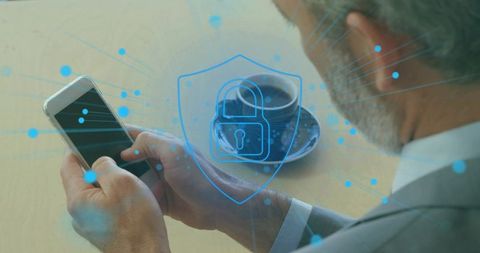 Executive securing smartphone with digital shield overlay and network security concept