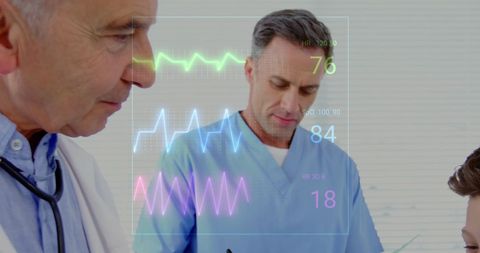 Male Doctors Analyzing Cardiograph Interface while Examining Patient